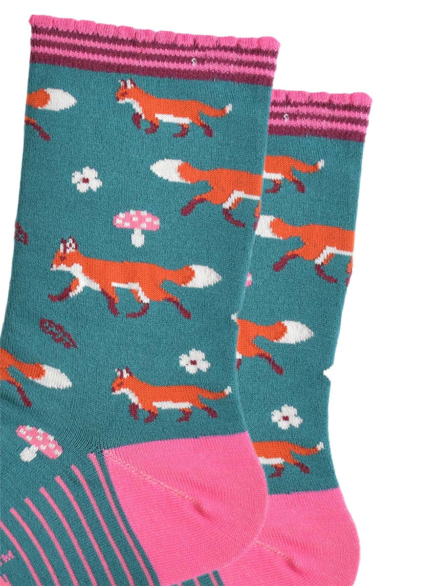 close up of the fox, toadstool and floral pattern on the socks