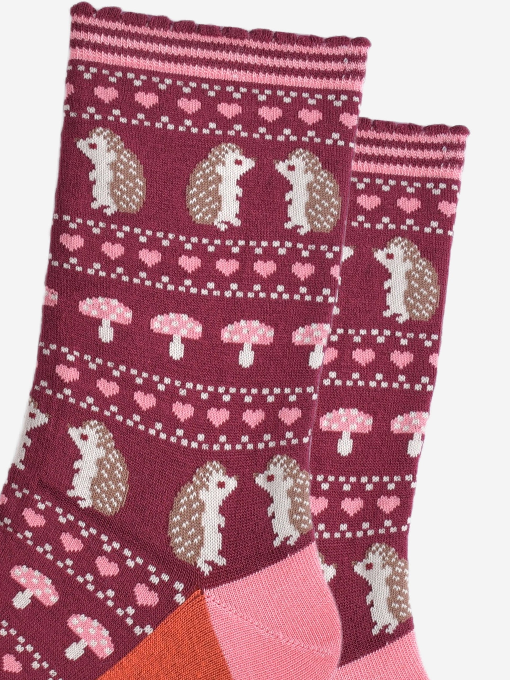 close up of the fair isle style design, showing hedgehogs, toadstools and love hearts in defined rows