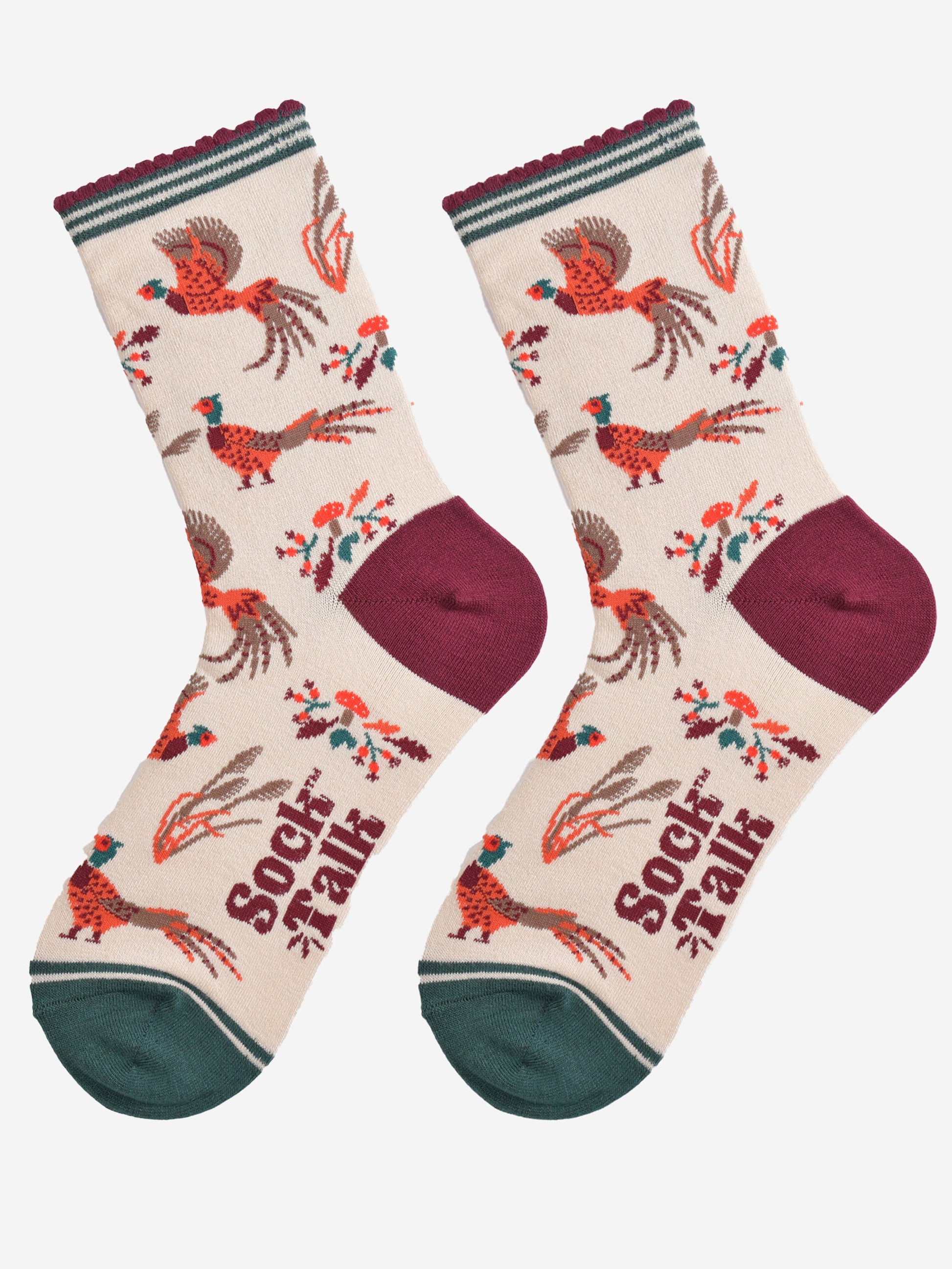 cream woodland pheasant socks laying flat, showing the all over pattern, the birds are in both walking and fluttering in flight 