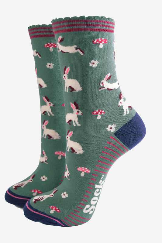 sage green ankle socks with a pattern of white rabbits and pink toadstools