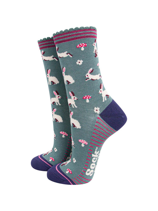 sage green ankle socks with a pattern of white rabbits and pink toadstools