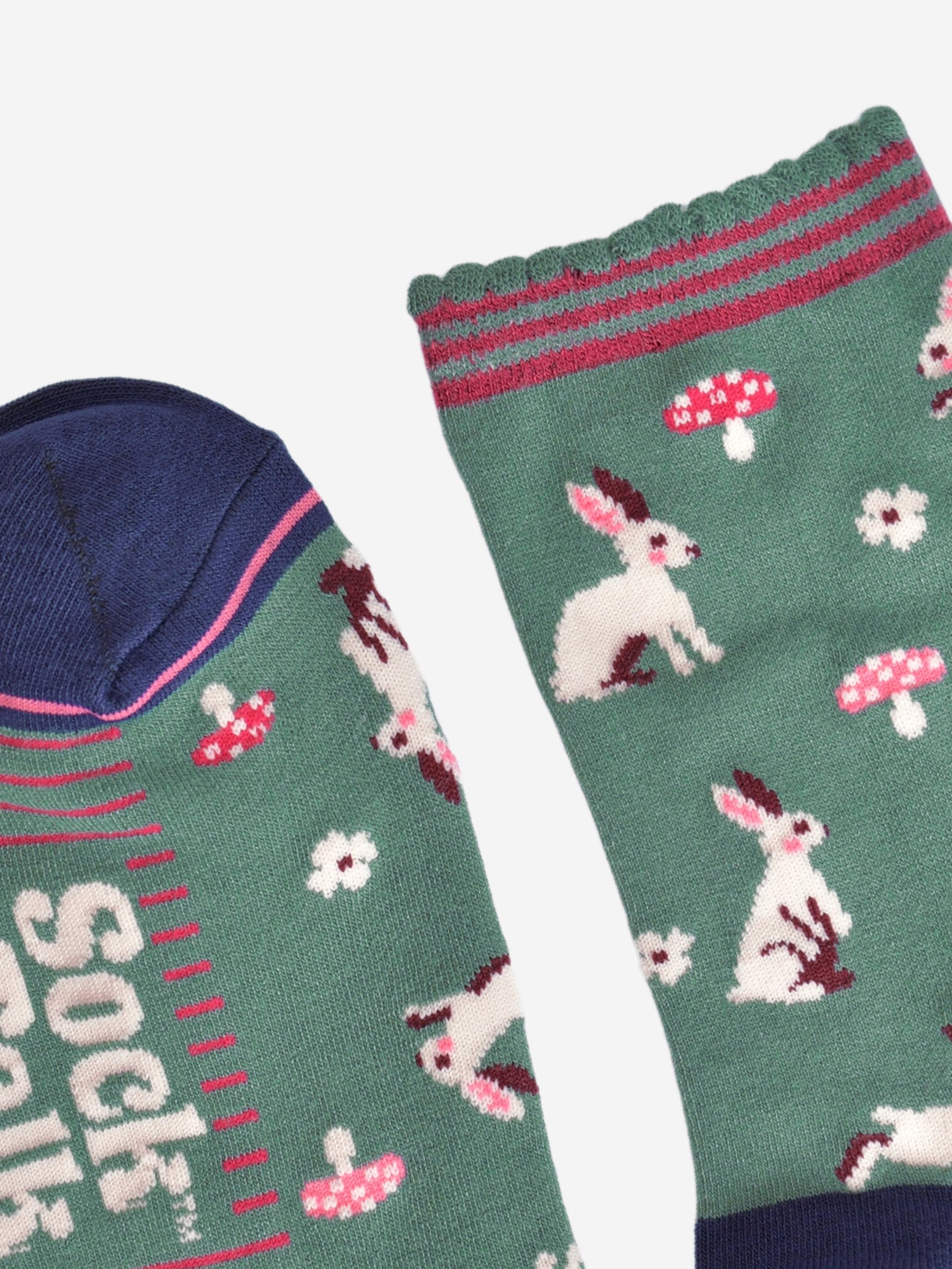 close up of the toe and cuff, the toe is navy blue with a pink border stripe, the cuff is green and scalloped with pink stripes