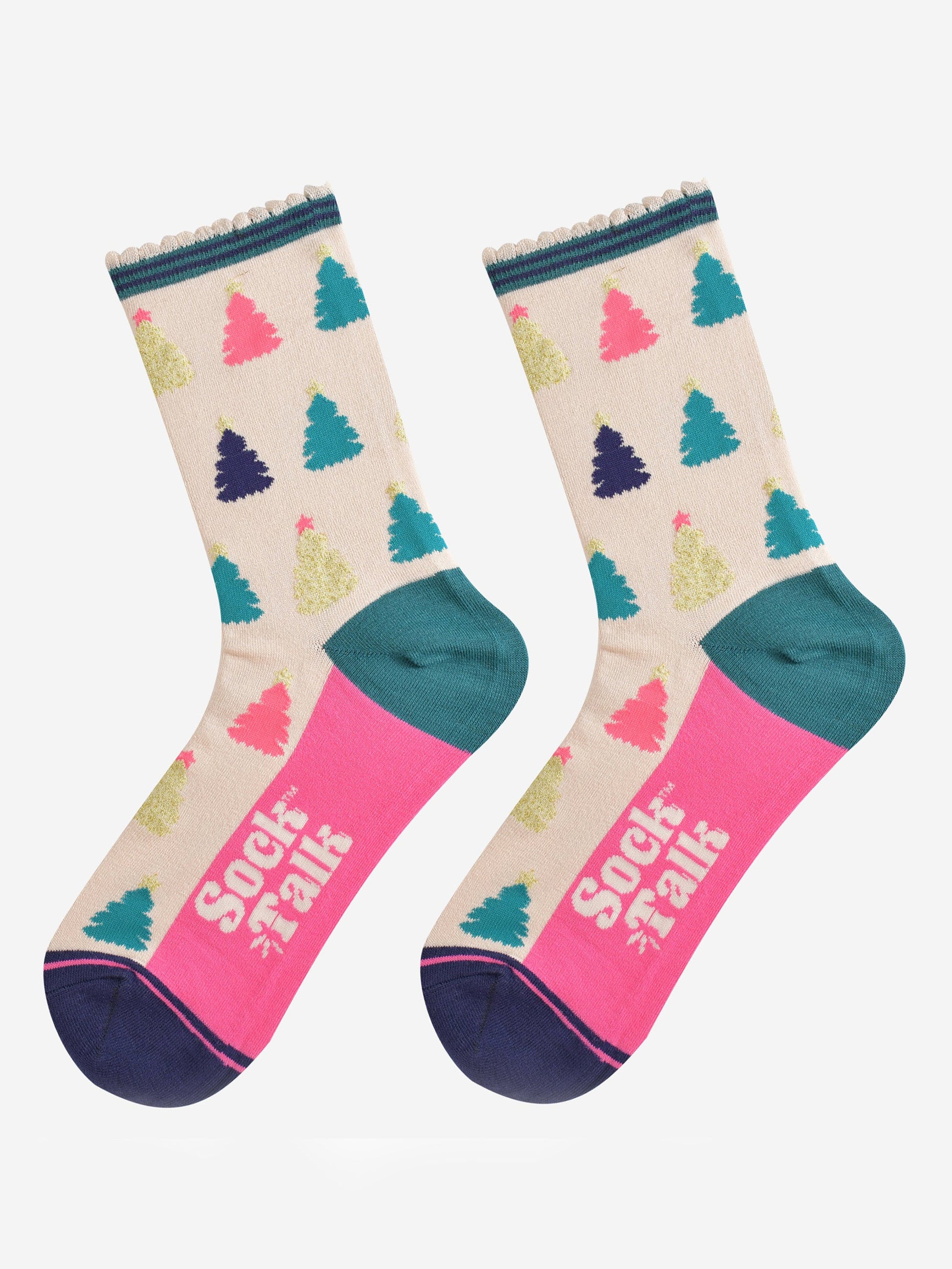 showing the christmas tree socks laying flat, the sole is hot pink in contrast to the cream body of the socks. the xmas tree pattern is all over an in a variety of colours, pink, gold, blue and green