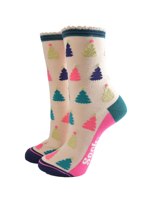 cream bamboo socks with a multicoloured christmas tree pattern all over, the trees are pink, gold, green and navy blue