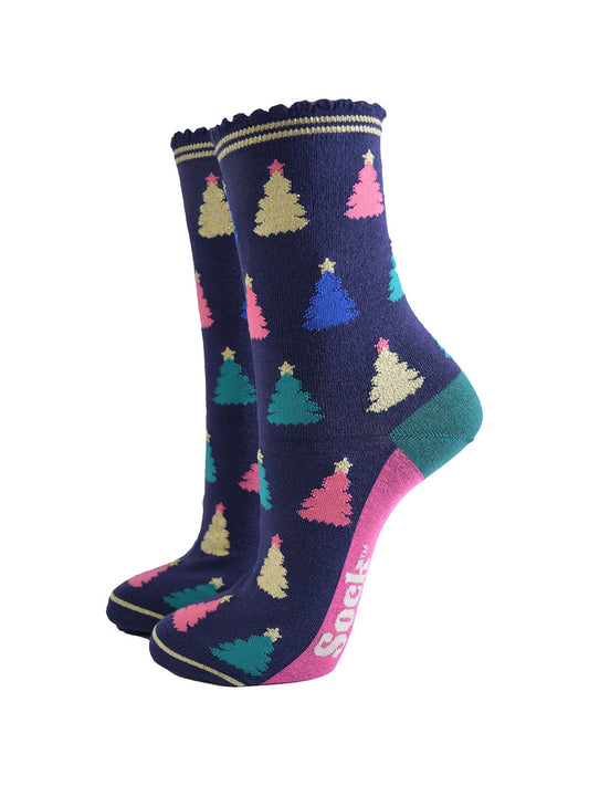 navy blue bamboo socks with a multicoloured christmas tree pattern all over, the trees are pink, gold, green and royal blue