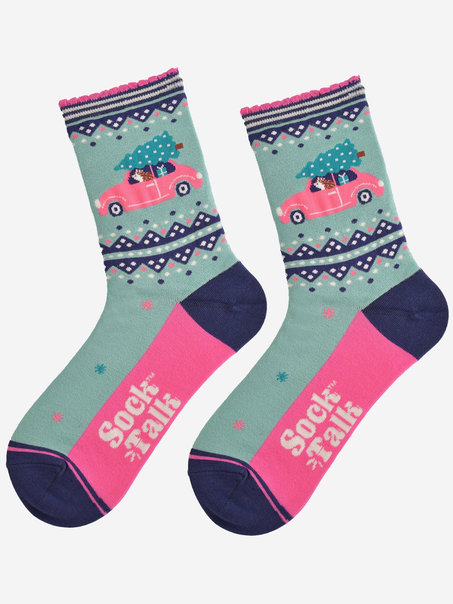 showing the socks laying flat, the sole is hot pink in contrast to the mint green base of the socks, the hedgehog driving the pink car is prominently shown on the ankle of the socks