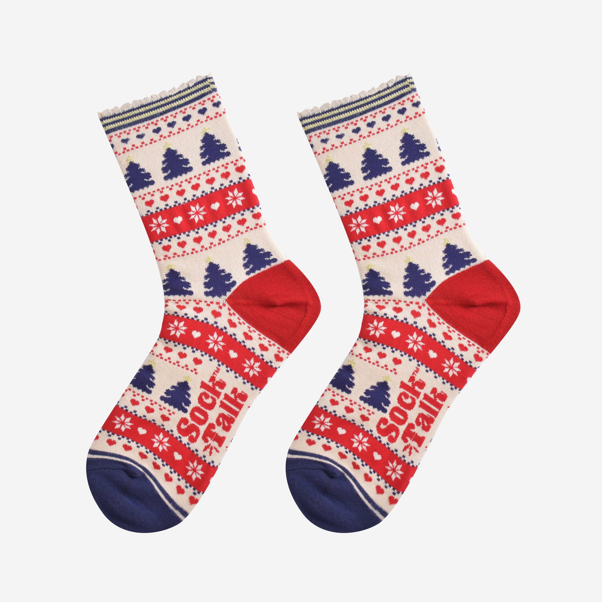showing the fair isle christmas tree socks laying flat, showing an all over pattern featuring trees, snowflakes and hearts