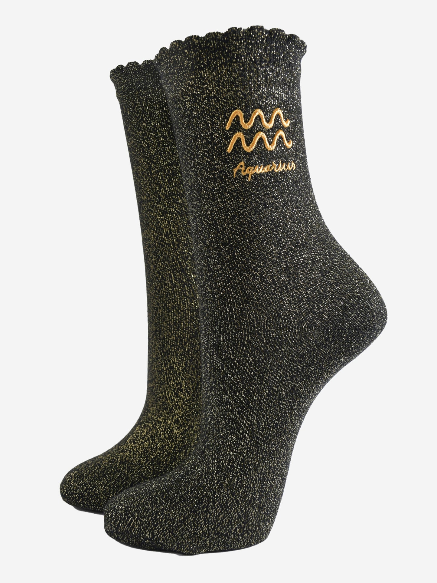 black and gold sparkly ankle socks with a scalloped cuff and an gold embroidered aquarius zodiac symbol and name