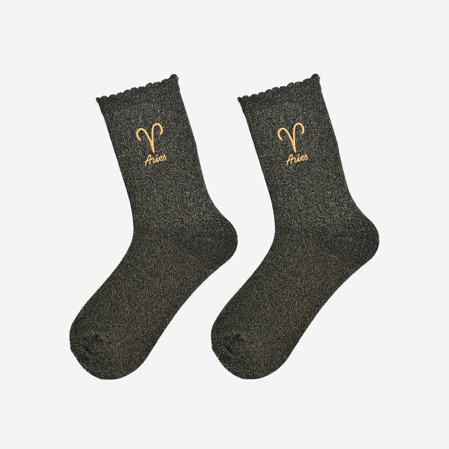 black and gold glitter embroidered aries socks laying flat, showing the all over gold glitter sparkle