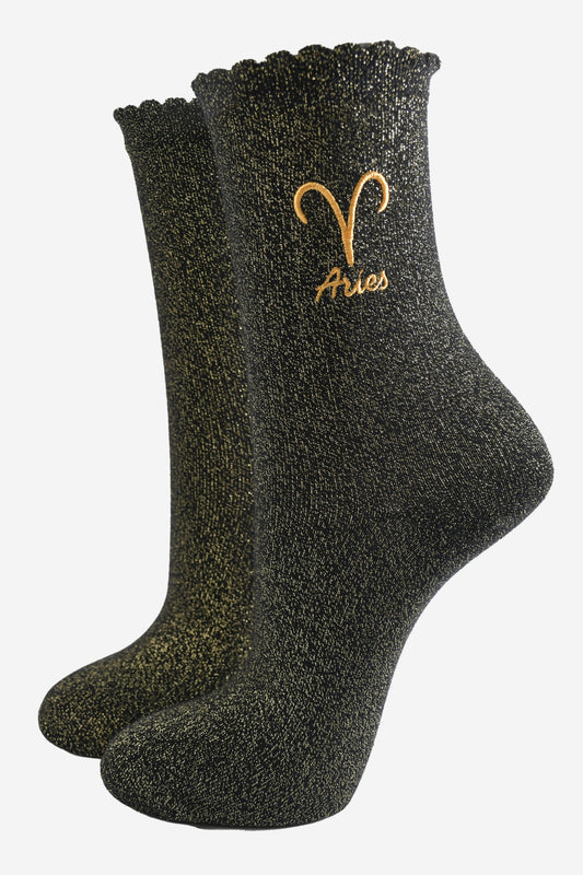 black and gold sparkly ankle socks with a scalloped cuff and an gold embroidered aries zodiac symbol and name