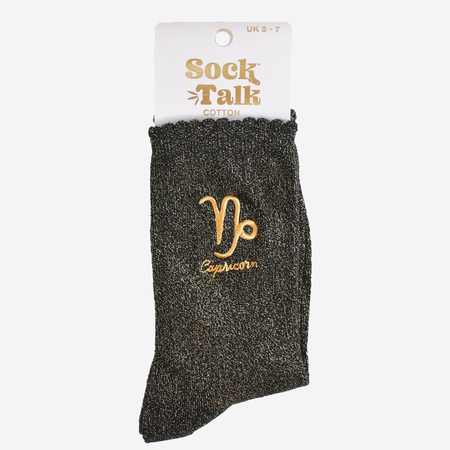 gold and black glitter capricorn socks in their sock talk packaging, these socks are a uk size 3-7