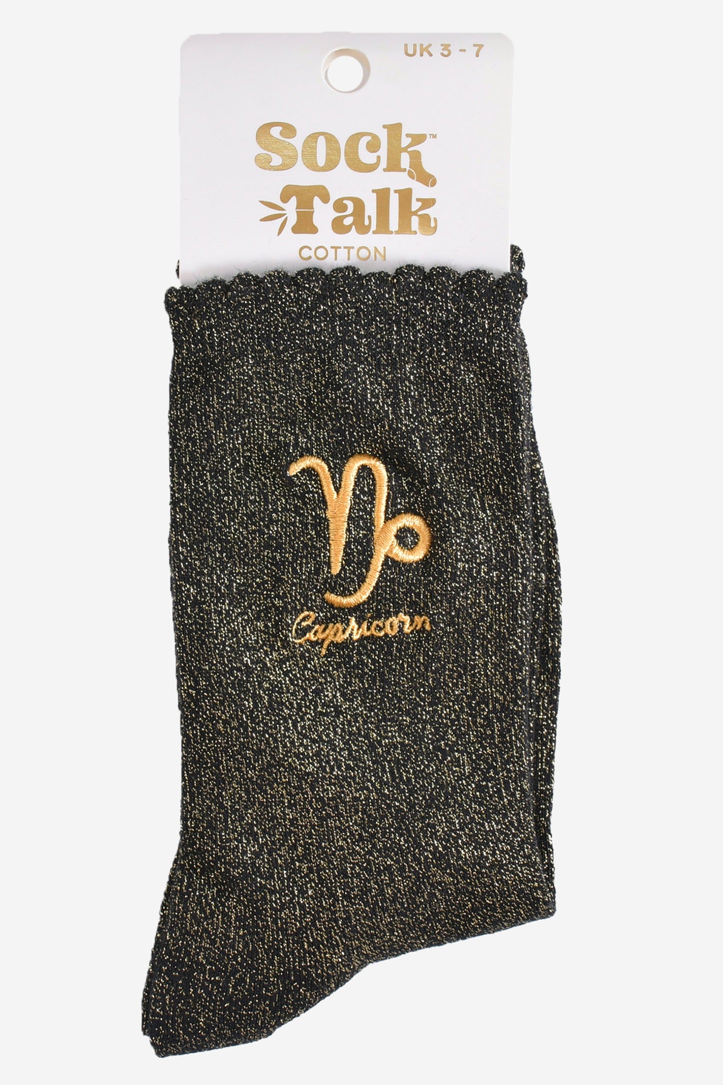 gold and black glitter capricorn socks in their sock talk packaging, these socks are a uk size 3-7