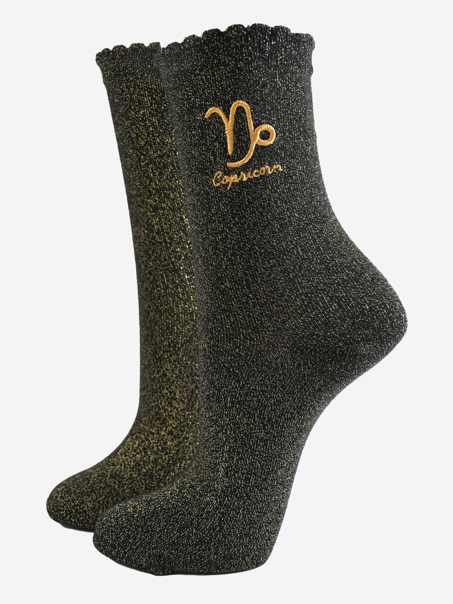 black and gold sparkly ankle socks with a scalloped cuff and an gold embroidered capricorn zodiac symbol and name