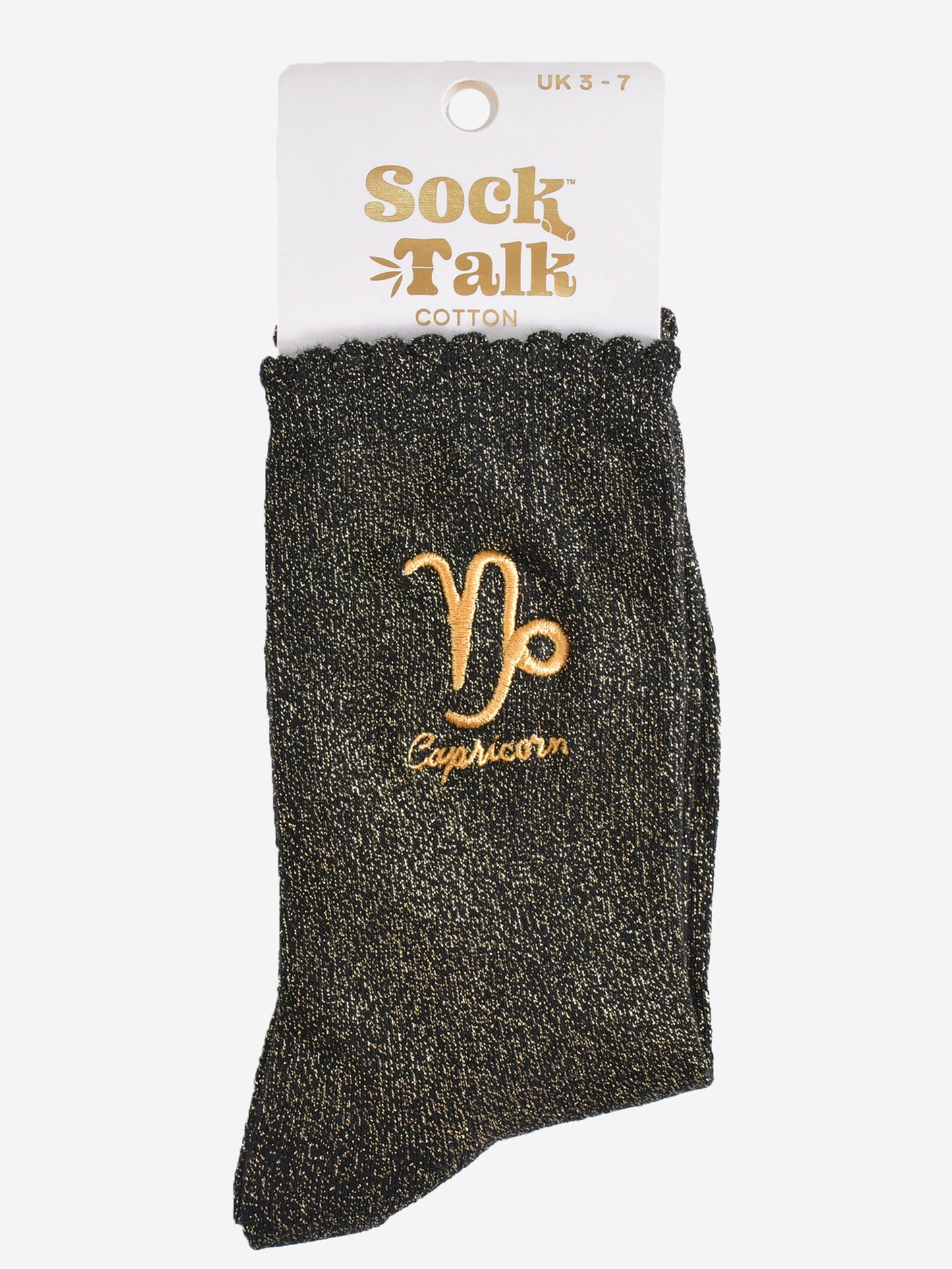 gold and black glitter capricorn socks in their sock talk packaging, these socks are a uk size 3-7