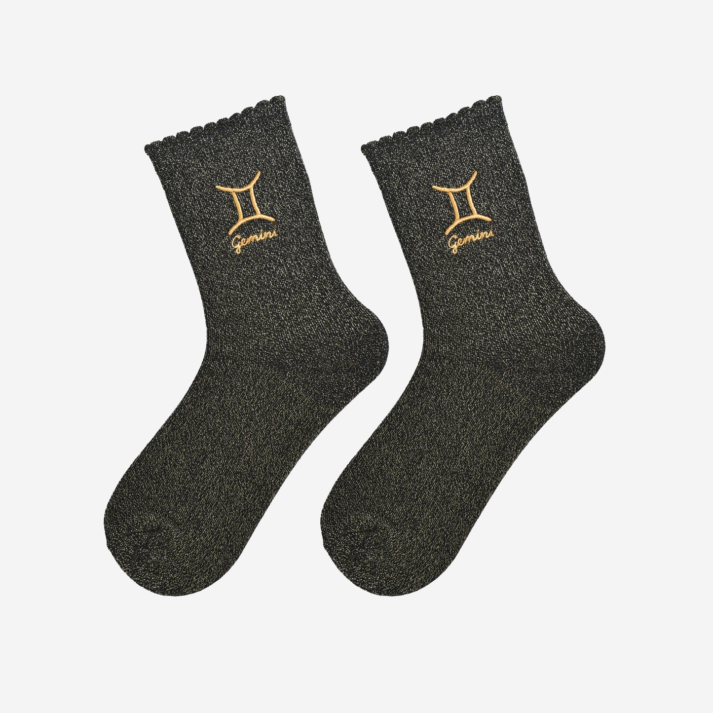 black and gold glitter embroidered gemini socks laying flat, showing the all over gold glitter sparkle