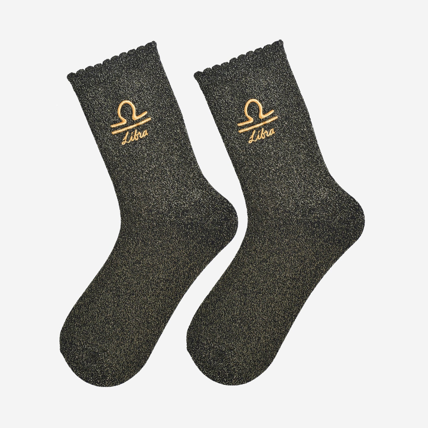 black and gold glitter embroidered libra socks laying flat, showing the all over gold glitter sparkle