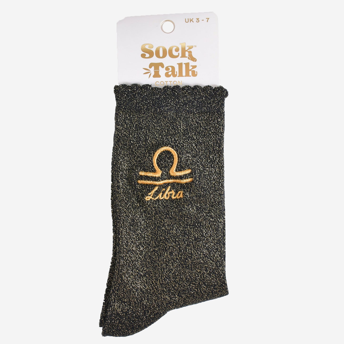 gold and black glitter libra socks in their sock talk packaging, these socks are a uk size 3-7