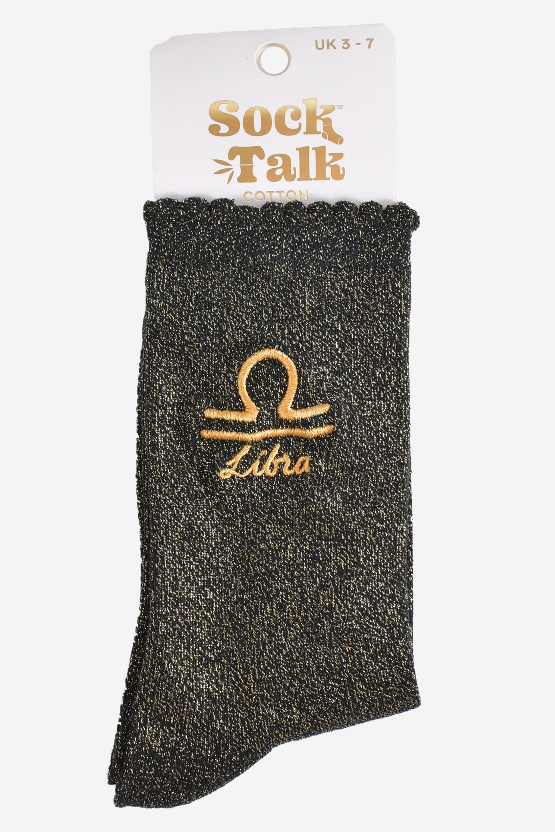 gold and black glitter libra socks in their sock talk packaging, these socks are a uk size 3-7