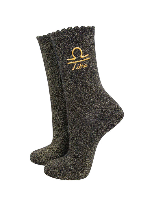 black and gold sparkly ankle socks with a scalloped cuff and an gold embroidered libra zodiac symbol and name