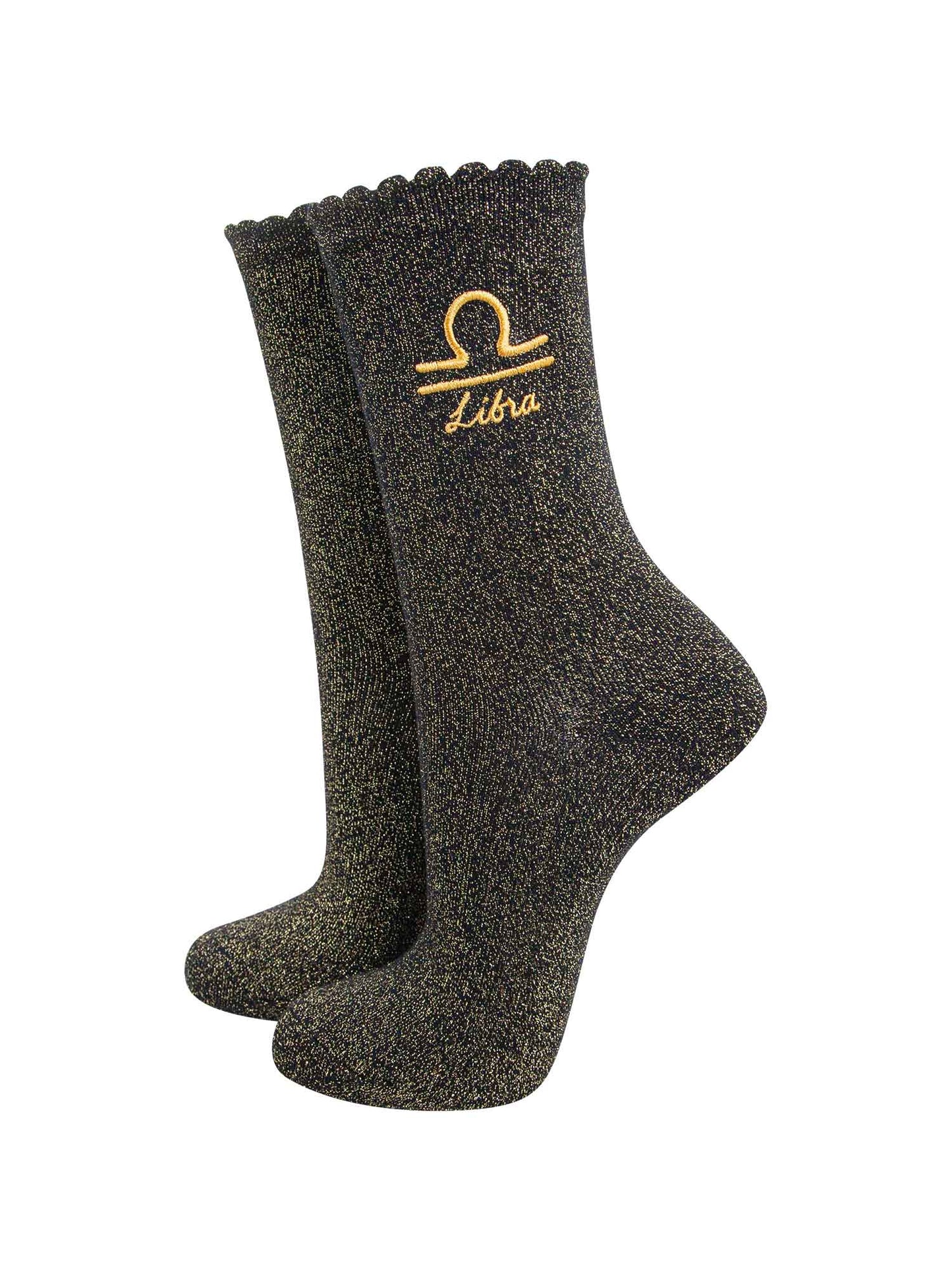 black and gold sparkly ankle socks with a scalloped cuff and an gold embroidered libra zodiac symbol and name