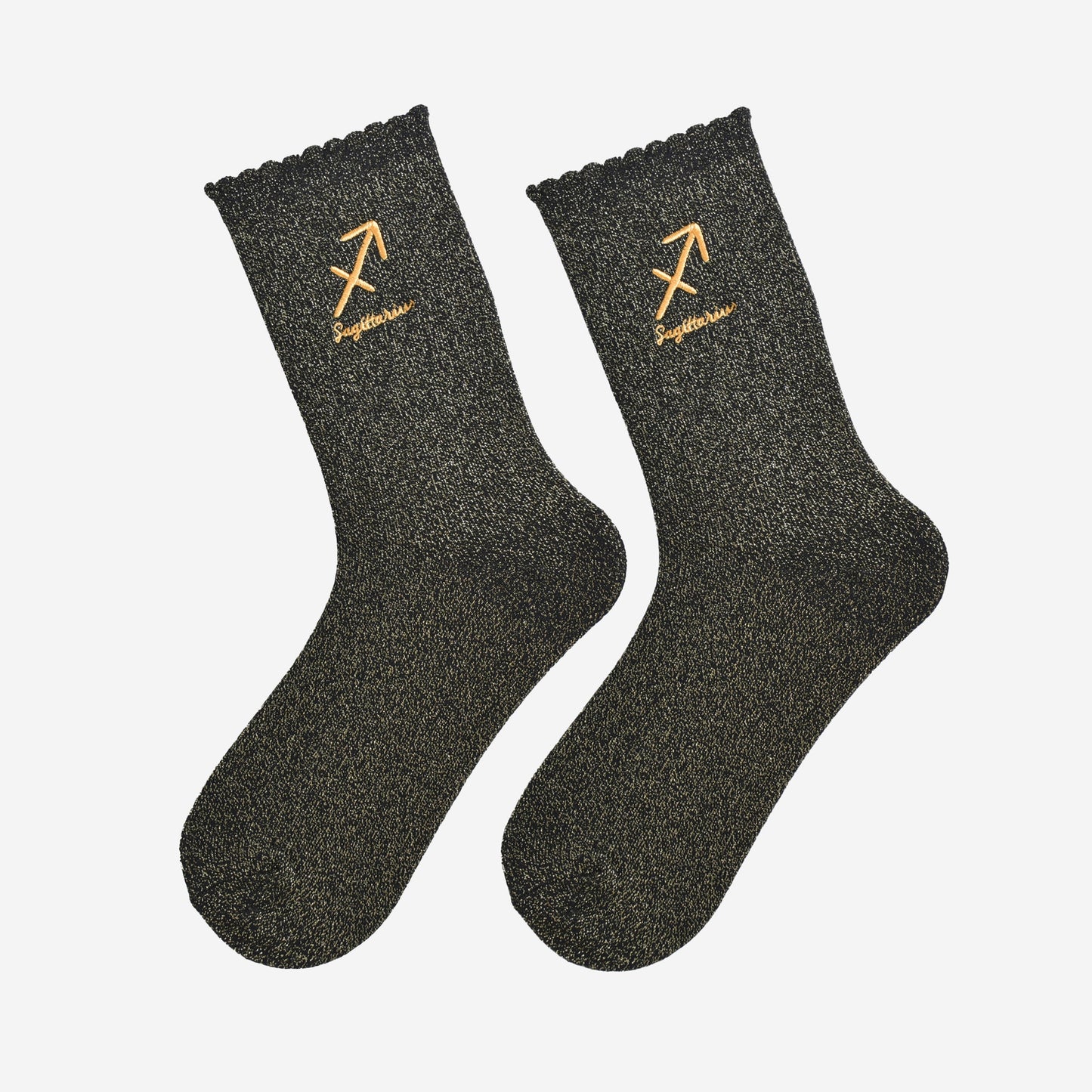 black and gold glitter embroidered sagittarius socks laying flat, showing the all over gold glitter sparkle