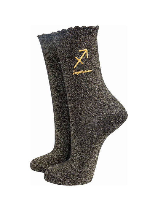 black and gold sparkly ankle socks with a scalloped cuff and an gold embroidered sagittarius zodiac symbol and name