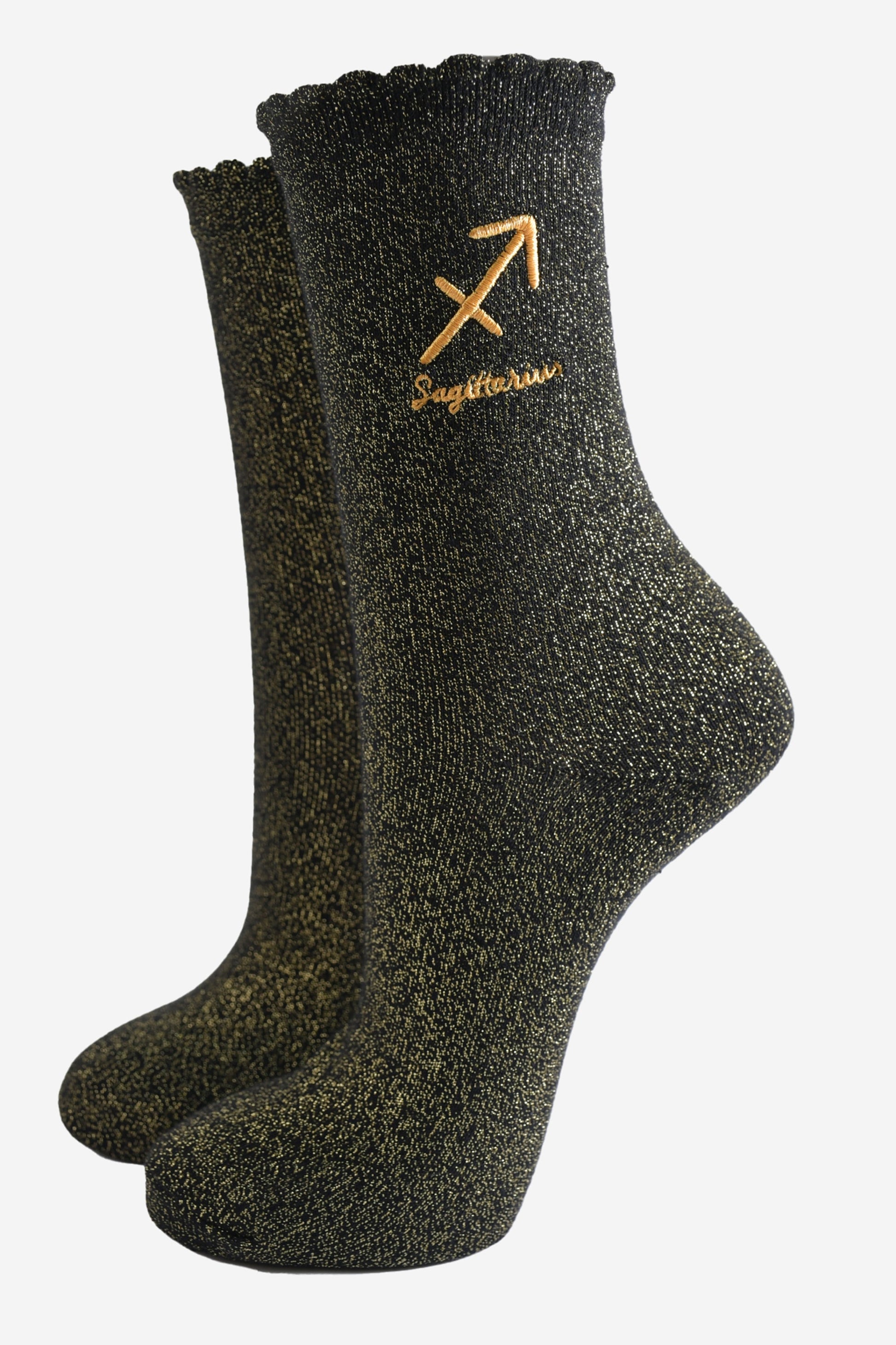 black and gold sparkly ankle socks with a scalloped cuff and an gold embroidered sagittarius zodiac symbol and name