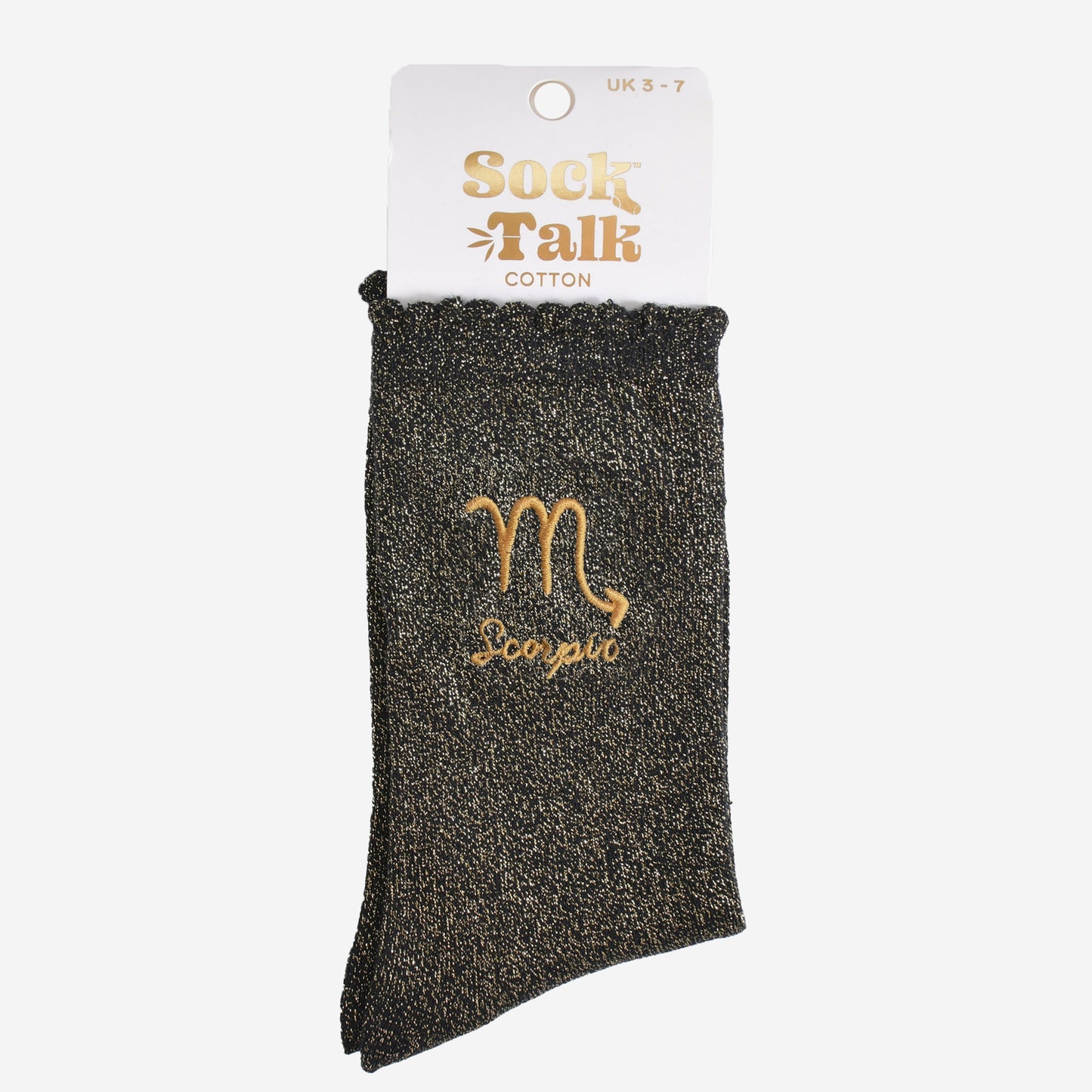 gold and black glitter scorpio socks in their sock talk packaging, these socks are a uk size 3-7