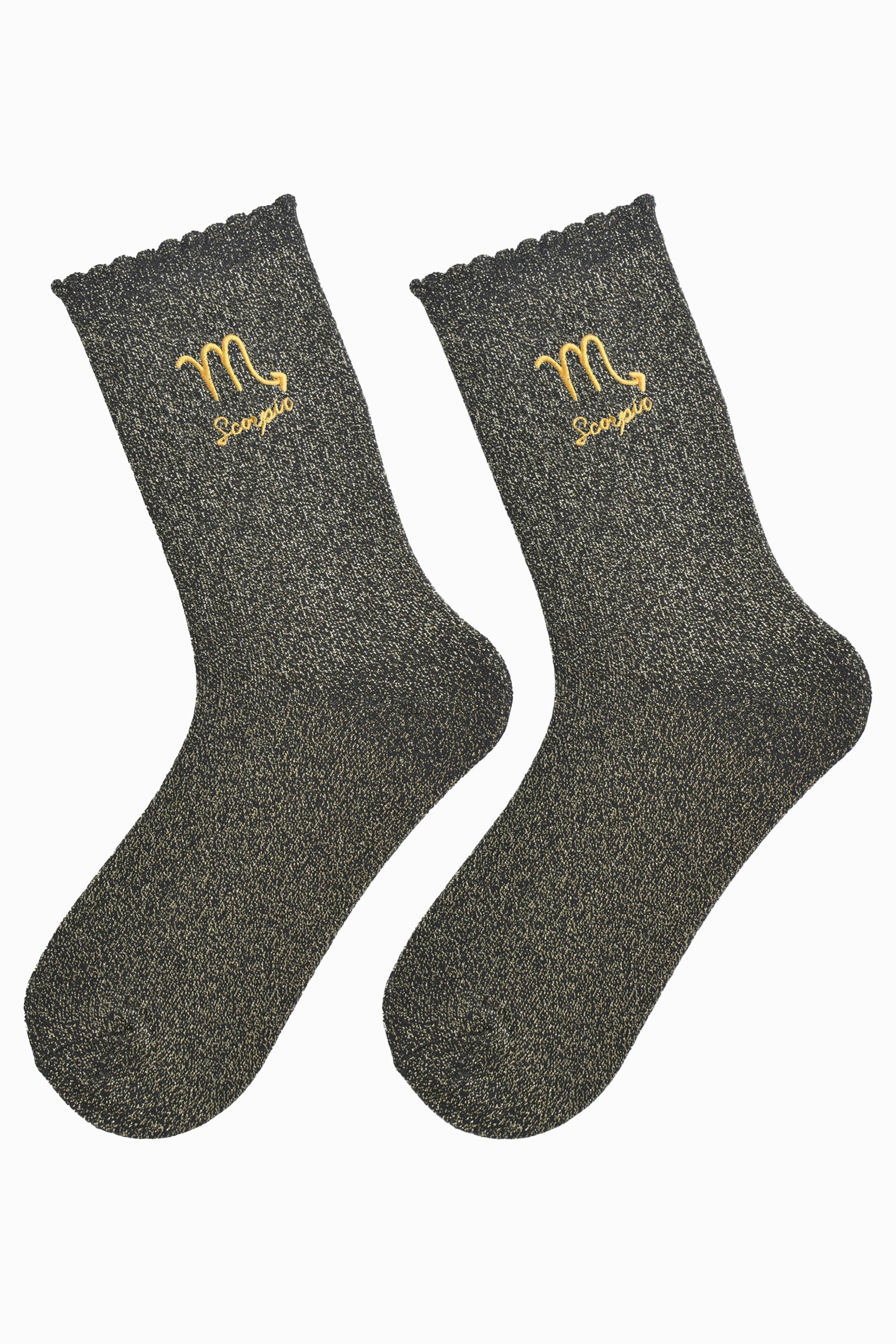 black and gold glitter embroidered scorpio socks laying flat, showing the all over gold glitter sparkle