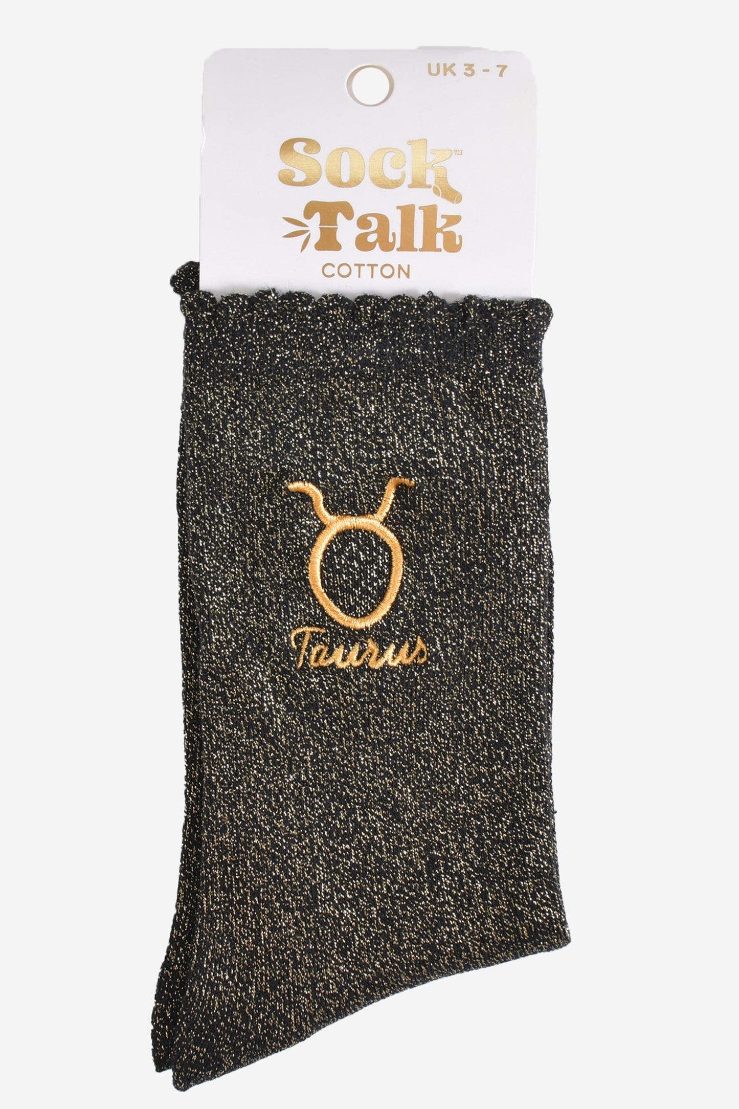 gold and black glitter taurus socks in their sock talk packaging, these socks are a uk size 3-7