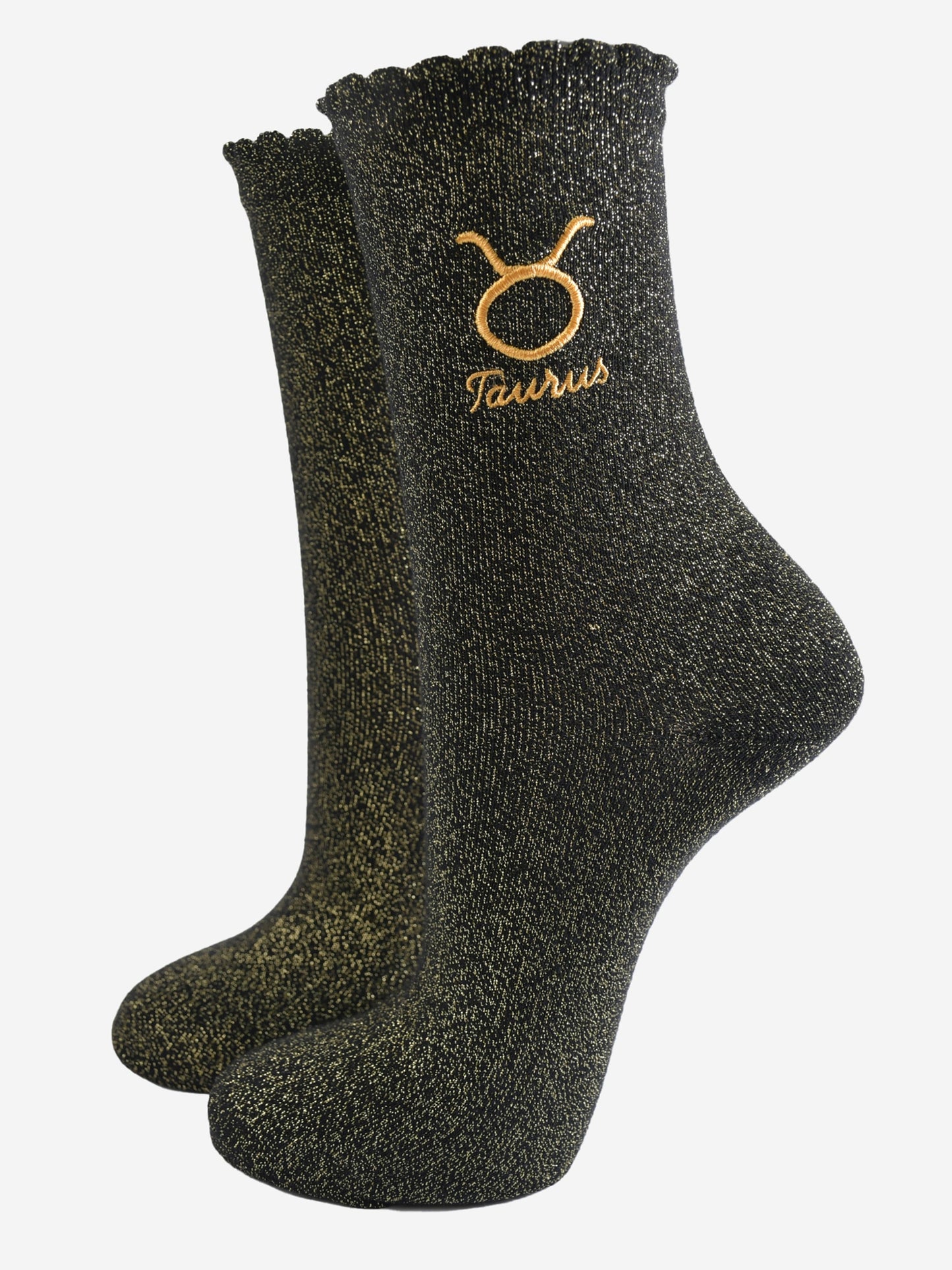 black and gold sparkly ankle socks with a scalloped cuff and an gold embroidered taurus zodiac symbol and name