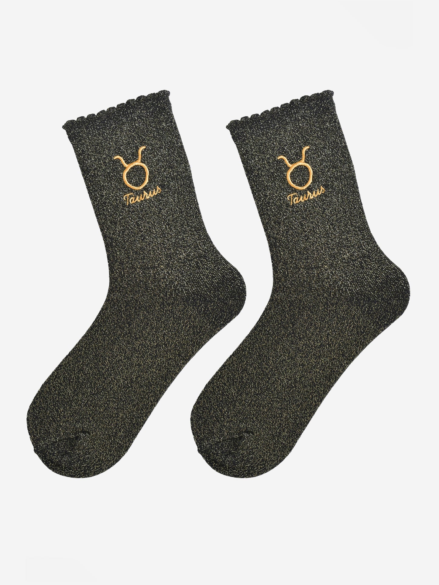 black and gold glitter embroidered taurus socks laying flat, showing the all over gold glitter sparkle