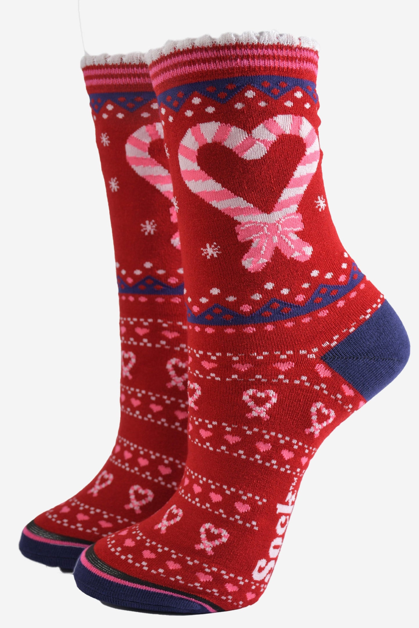 red bamboo socks with a pattern of pink love hearts made from adjoining candy canes