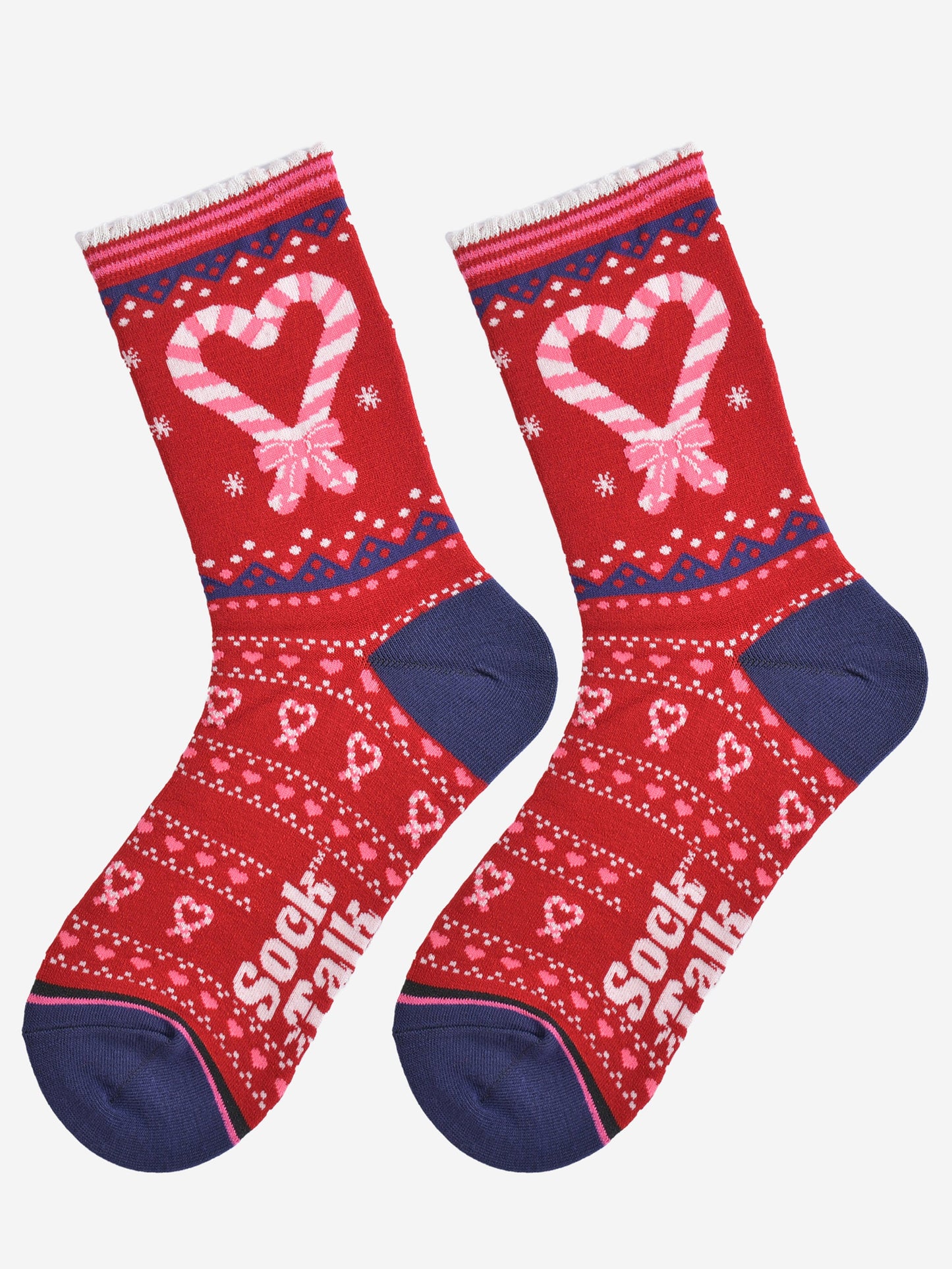 showing the candy cane heart socks laying flat, there is a large candy cane heart on the ankle of the socks along with a fair isle style pattern featuring candy canes on the remainder of the socks