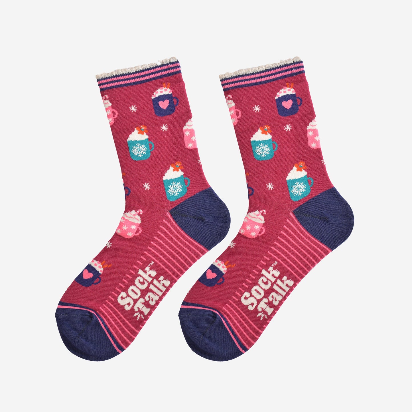 showing the hot drinks socks laying flat, the sole has a pink striped pattern, the toe and heel are navy blue and contrast the berry red colour of the socks, the festive hot drinks pattern is all over the design.