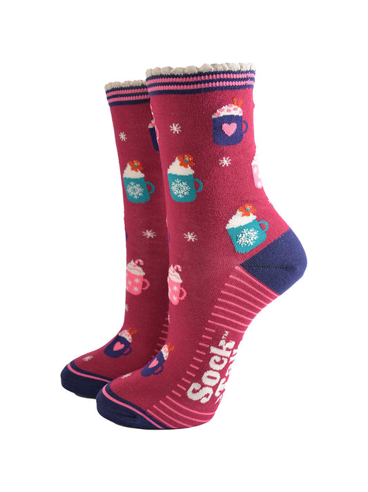 berry red bamboo socks with a pattern of hot winter drinks, candy canes and gingerbread men