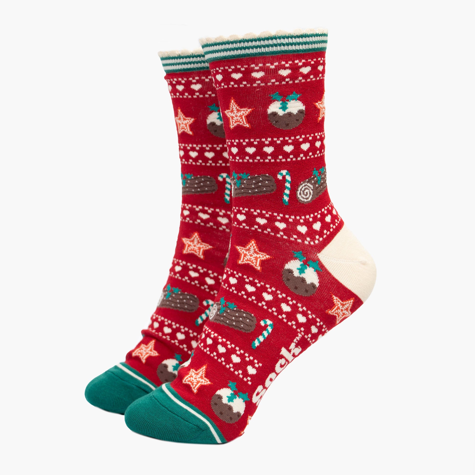 red and green fair isle style bamboo socks with a festive food themed pattern. there are xmas puddings, yule logs and candy canes all featured on the socks.