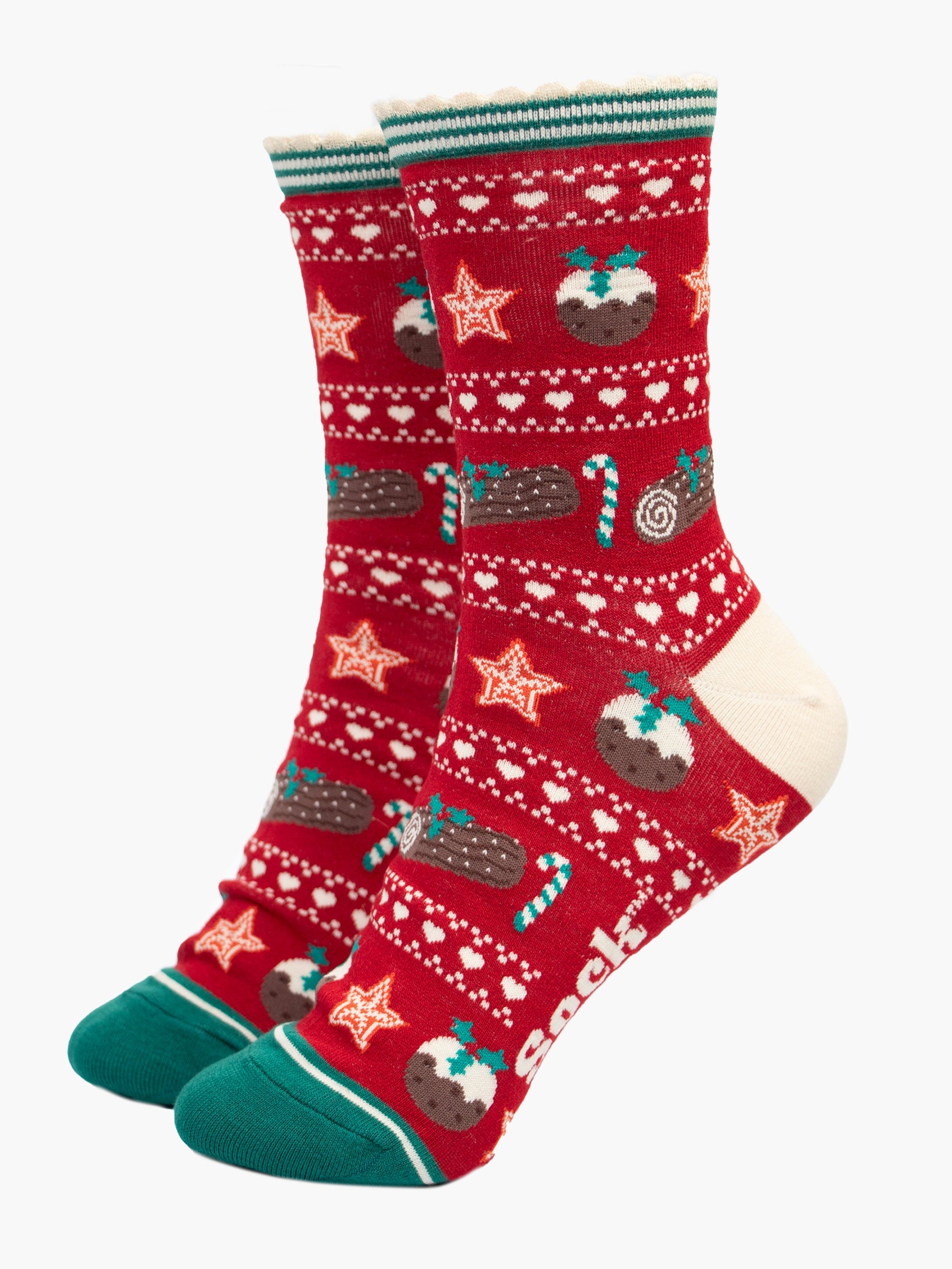 red and green fair isle style bamboo socks with a festive food themed pattern. there are xmas puddings, yule logs and candy canes all featured on the socks.