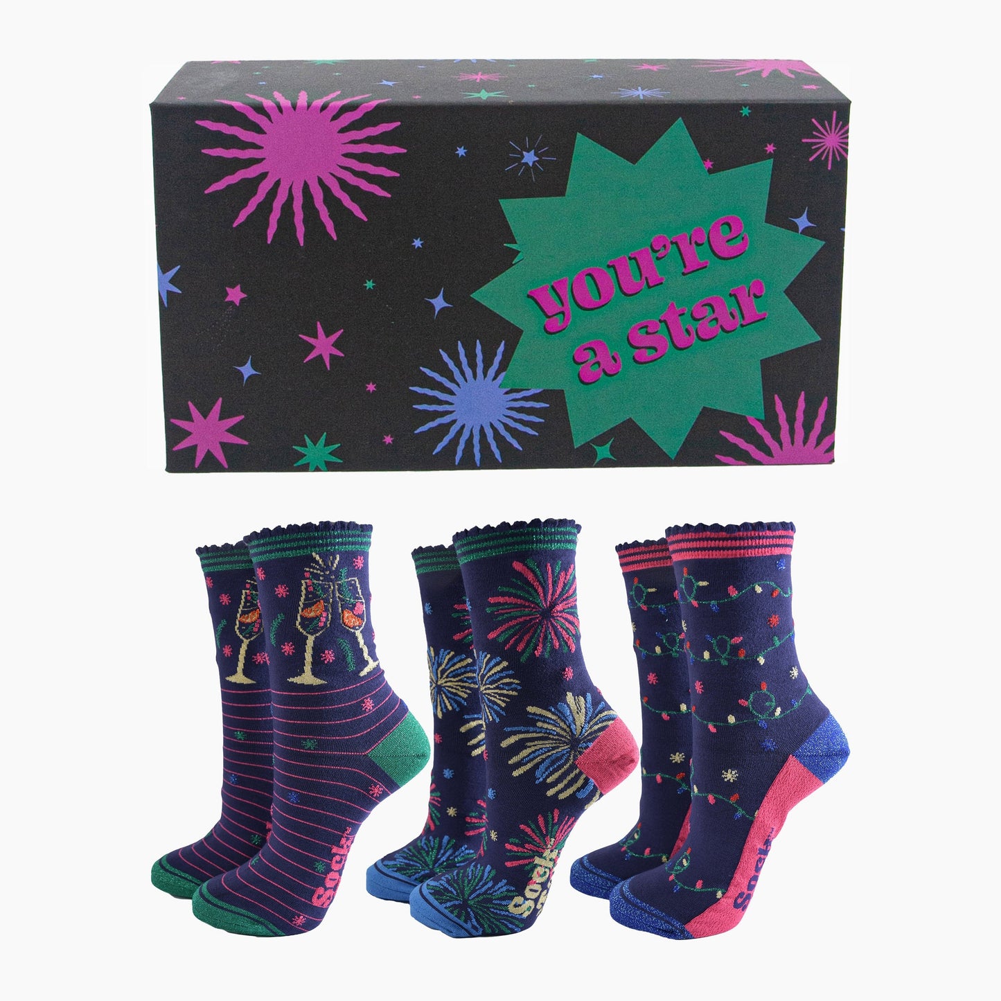 three pairs of celebratory bamboo socks in a black star print gift box with the phrase "you're a star" written on it. the socks feature cockails, fireworks and party lights