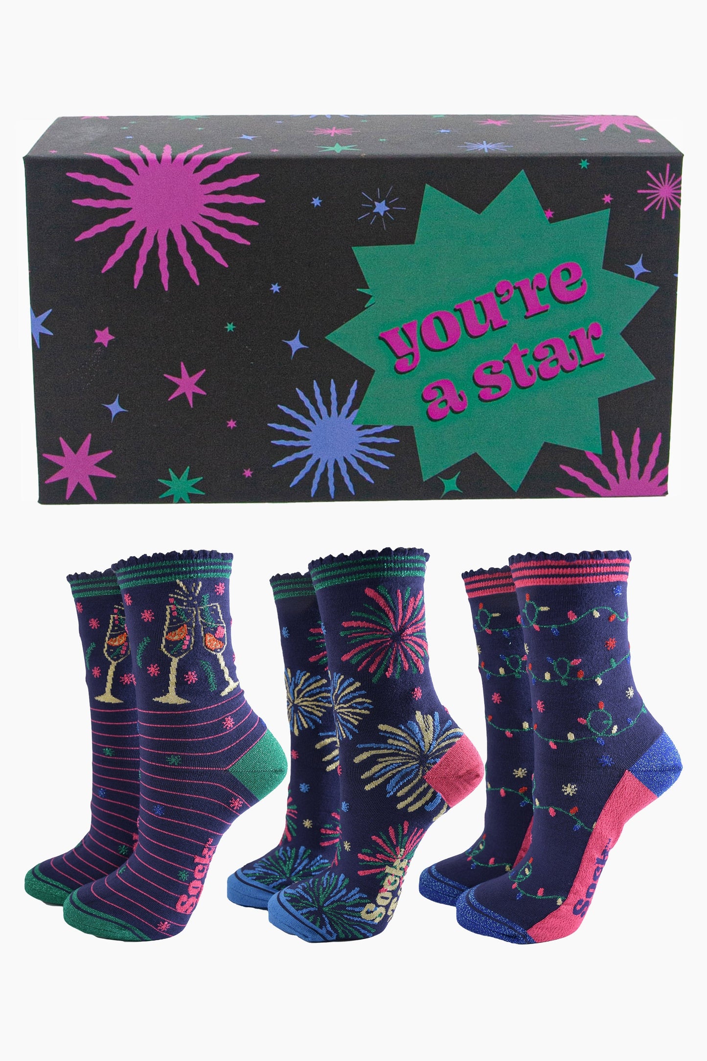 three pairs of celebratory bamboo socks in a black star print gift box with the phrase "you're a star" written on it. the socks feature cockails, fireworks and party lights