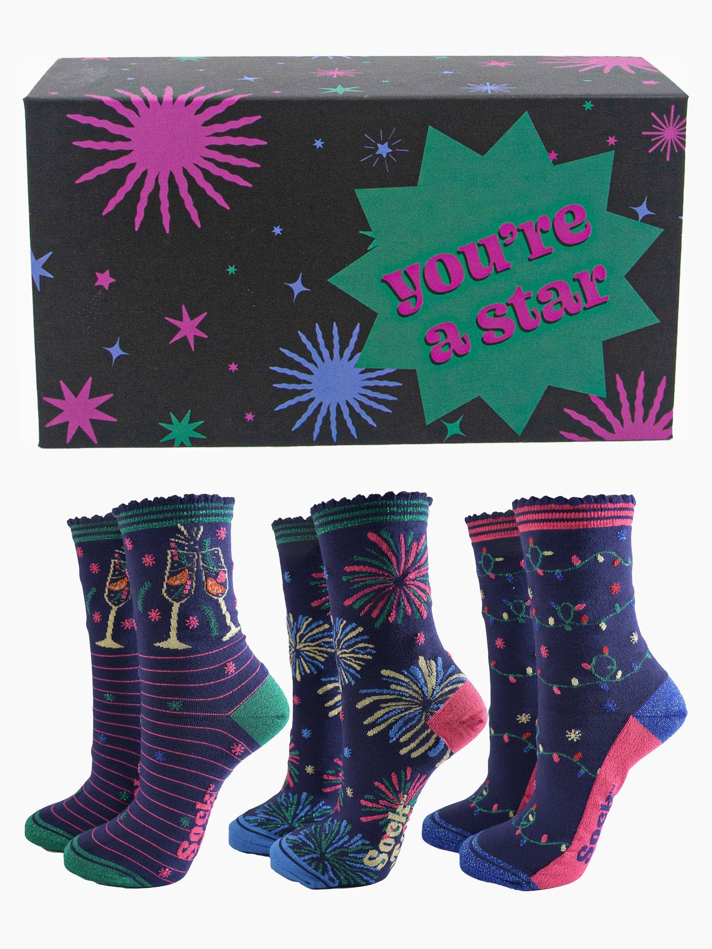 three pairs of celebratory bamboo socks in a black star print gift box with the phrase "you're a star" written on it. the socks feature cockails, fireworks and party lights