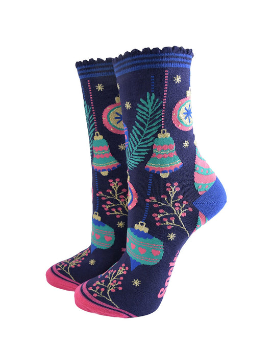 navy blue socks with colourful christmas tree baubles and bells, pink berries and gold starbursts. 