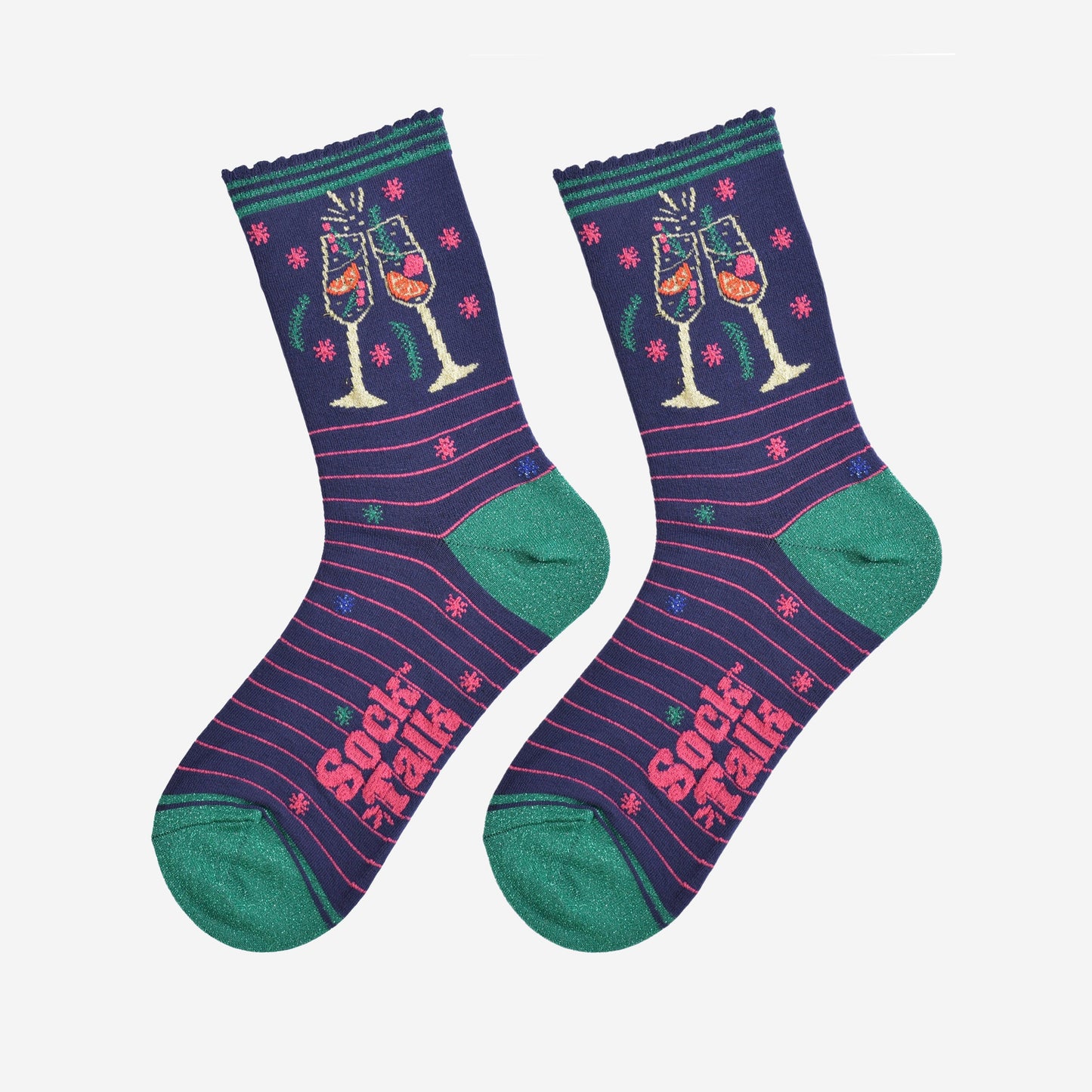 showing the prosecco cocktail socks laying flat, there are sparkly accents all over the design, the toe and heel are green and there is a pink pink stripe throughout the design, the cocktail glasses are shown on the ankle