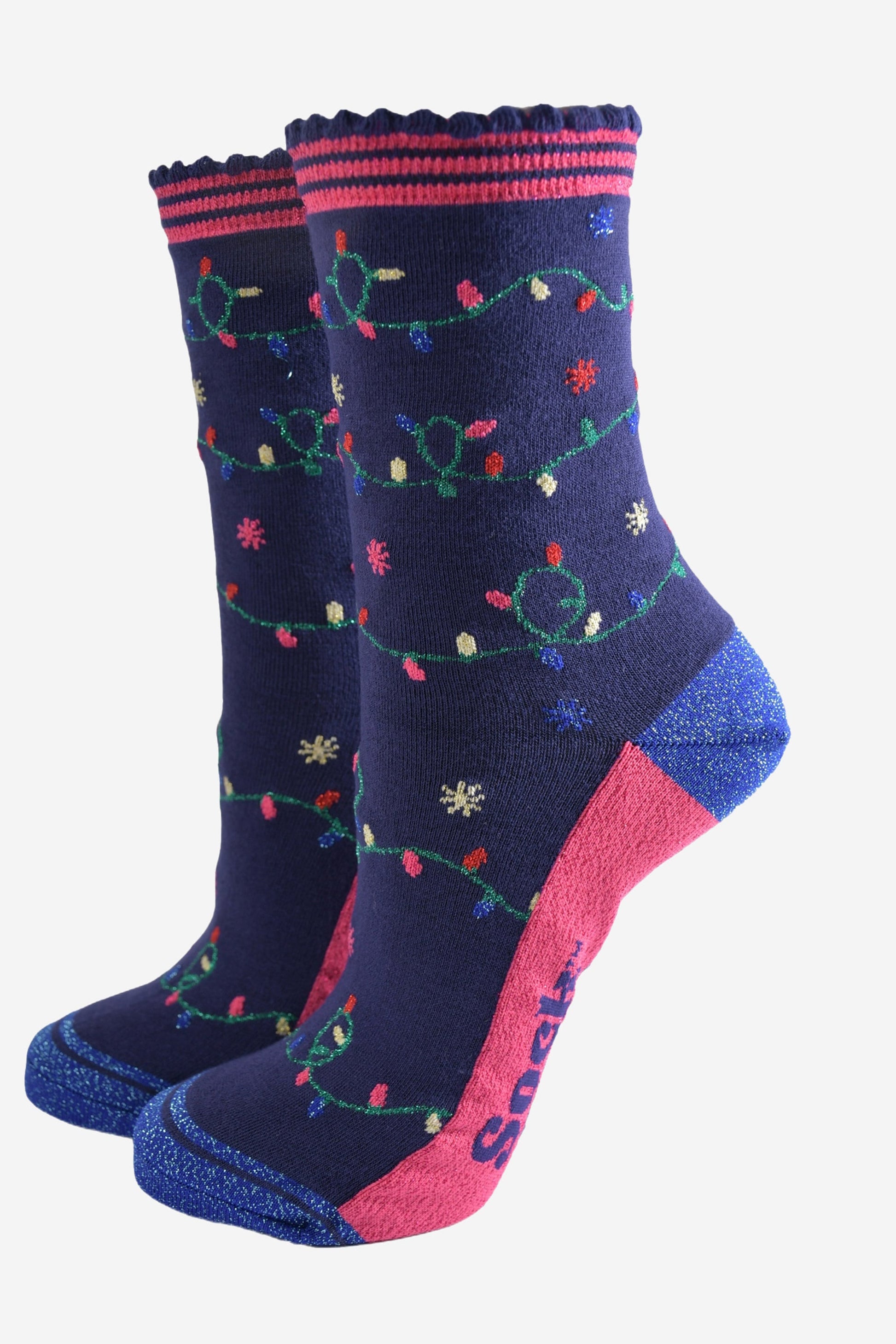 navy blue socks with  blue glitter heel and toe with an all over pattern of colourful party lights on a string