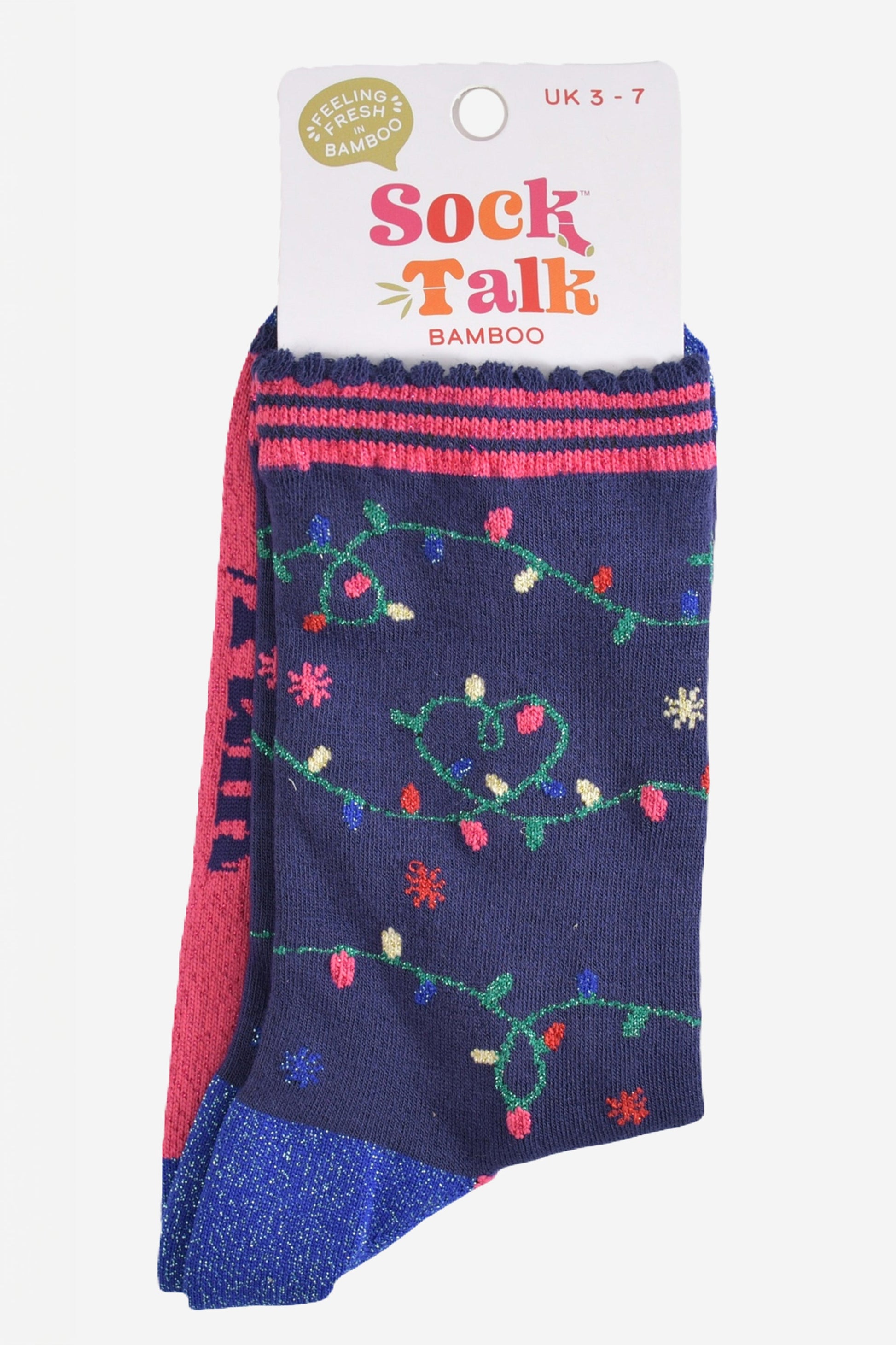 festive party lights bamboo socks in their sock talk packaging, these socks are a uk size 3-7