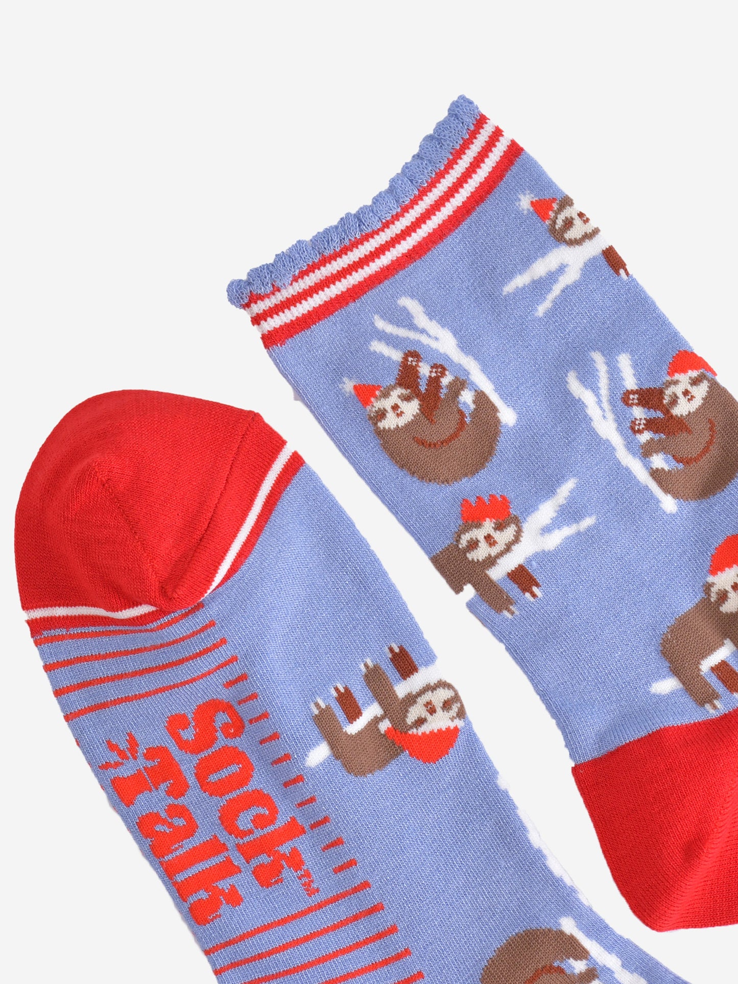 close up oft the toe and cuff of the socks, the toe is red with a white border stripe, the cuffs are scalloped and have red and white stripes