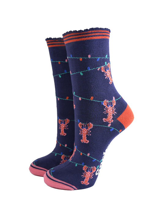 navy blue bamboo socks with a pattern of colourful party lights with pink and red lobsters playfully dangling from them