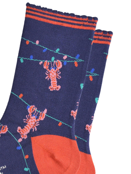 close up of the lobster and party light pattern, showing pink lobsters grabbing onto a string of colourful party lights