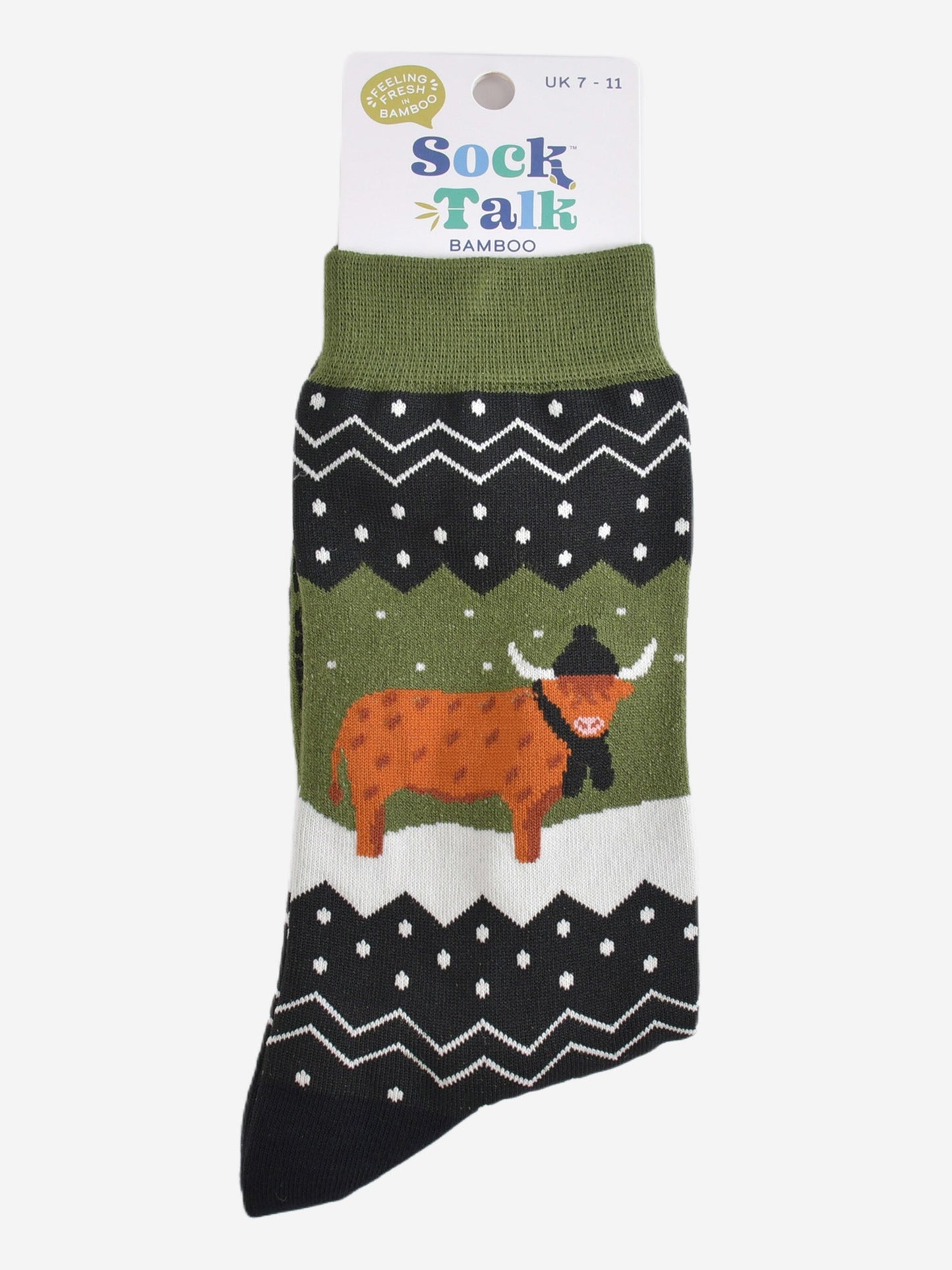 green fair isle highland cow socks in their sock talk packaging, these socks are a uk size 7-11