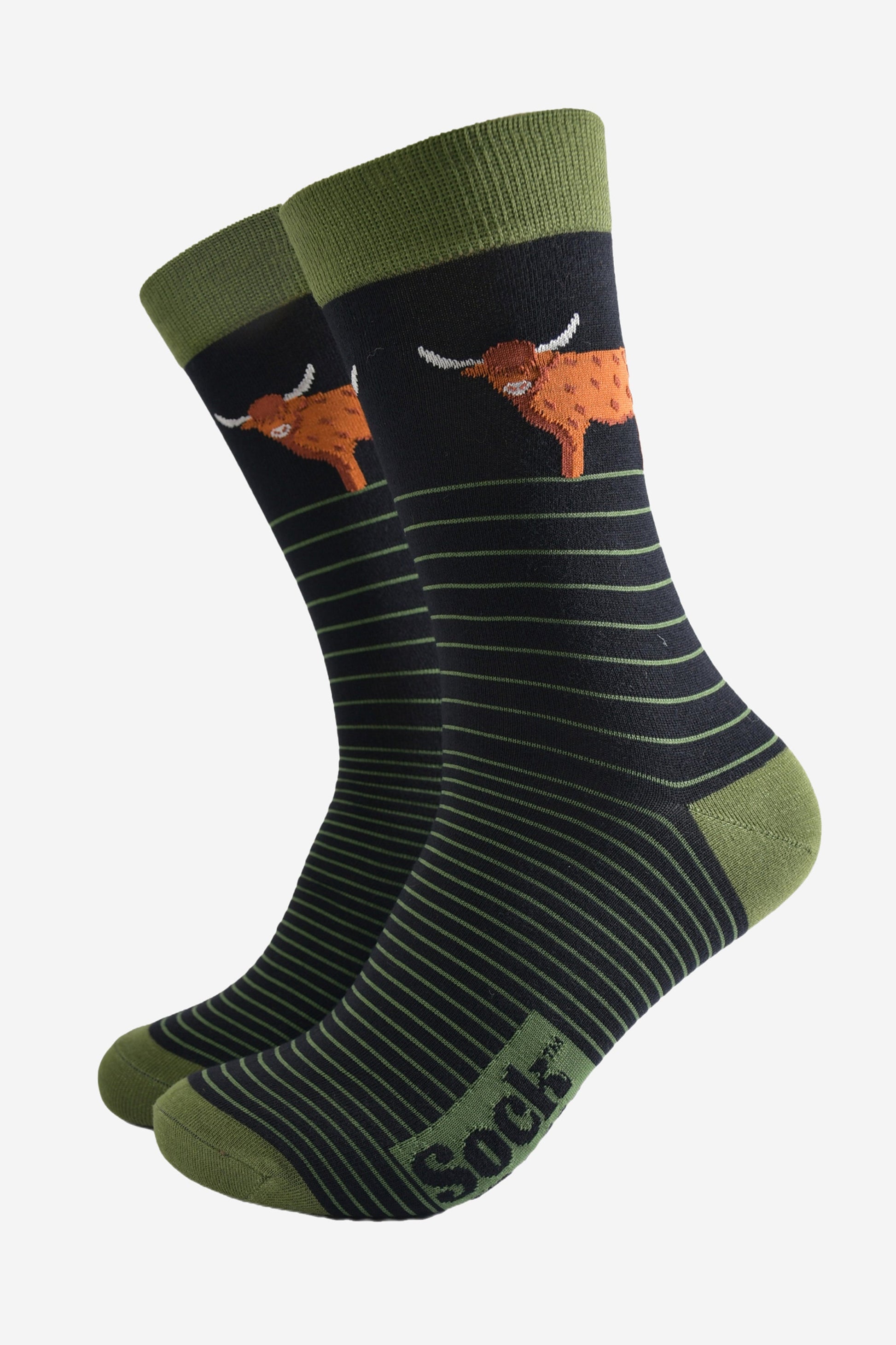 black socks with light green pin striped and a large standing highland cow on the ankle